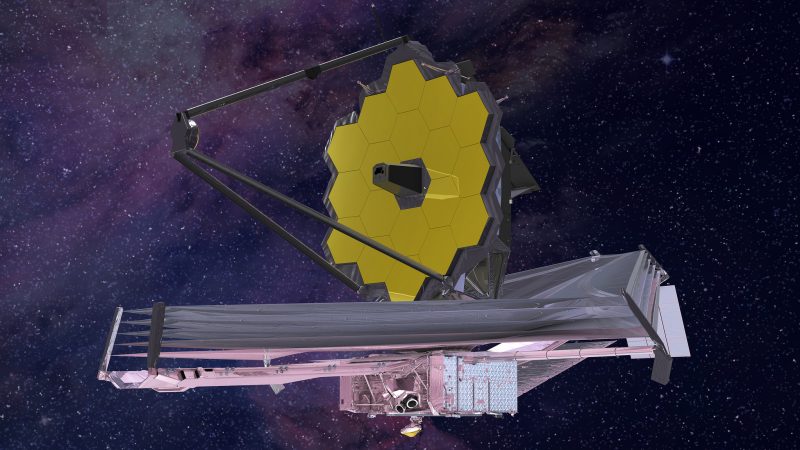 Floating in space, a spacecraft with a large curved mirror made of gold hexagons.