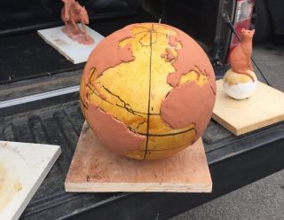 The bronze Félicette statue will be mounted on this globe base, with Europe (and France) visible in the front.