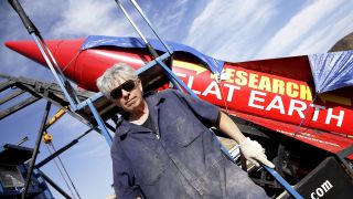 'Mad' Mike Hughes stands beside his rocket in his roadside launch area near Amboy, California on Nov. 27, 2017. Hughes aims to launch to high highest altitude ever this upcoming Sunday, Aug. 11. 