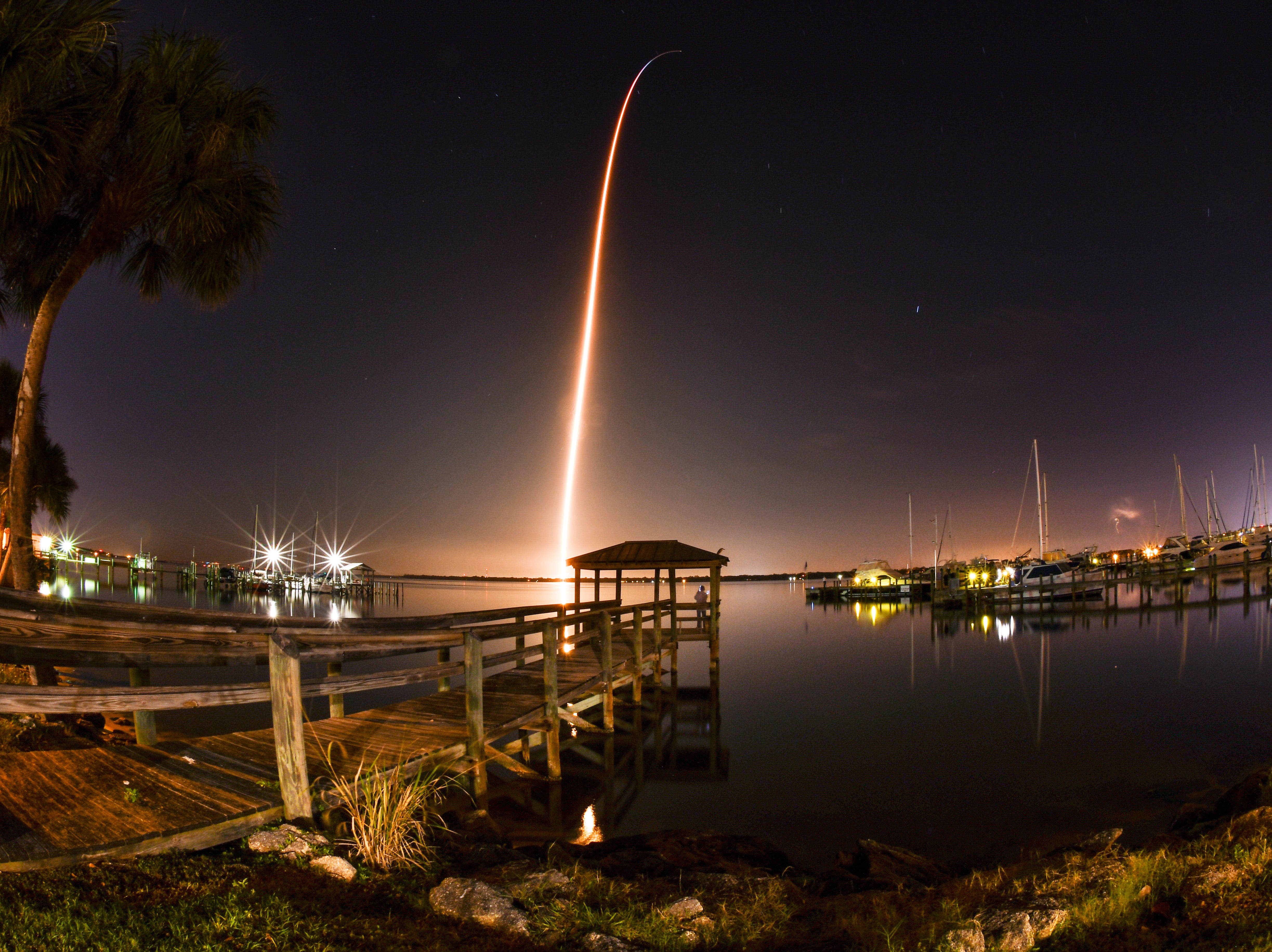 The SpaceX Crew Dragon capsule atop a Falcon 9 rocket launches to the International Space Station from the Kennedy Space Center at 2:39 a.m. March 2, 2019. The test flight is part of NASA's Commercial Crew Program to launch astronauts once again from U.S. soil. The capsule is carrying a test dummy to measure the responses on the human body and its surrounding environment. Photo is a 153 second time exposure viewed from the shores of the Indian River in Cocoa. 