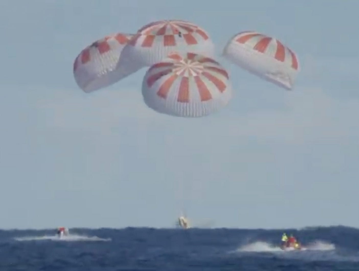 A grab taken from a NASA TV live feed shows SpaceX’s Dragon capsule splash down in the Atlantic Ocean, from the International Space Station March 8, 2019. The Crew Dragon docked autonomously to the orbiting laboratory, a historic first for a commercially built and operated US crew spacecraft. 