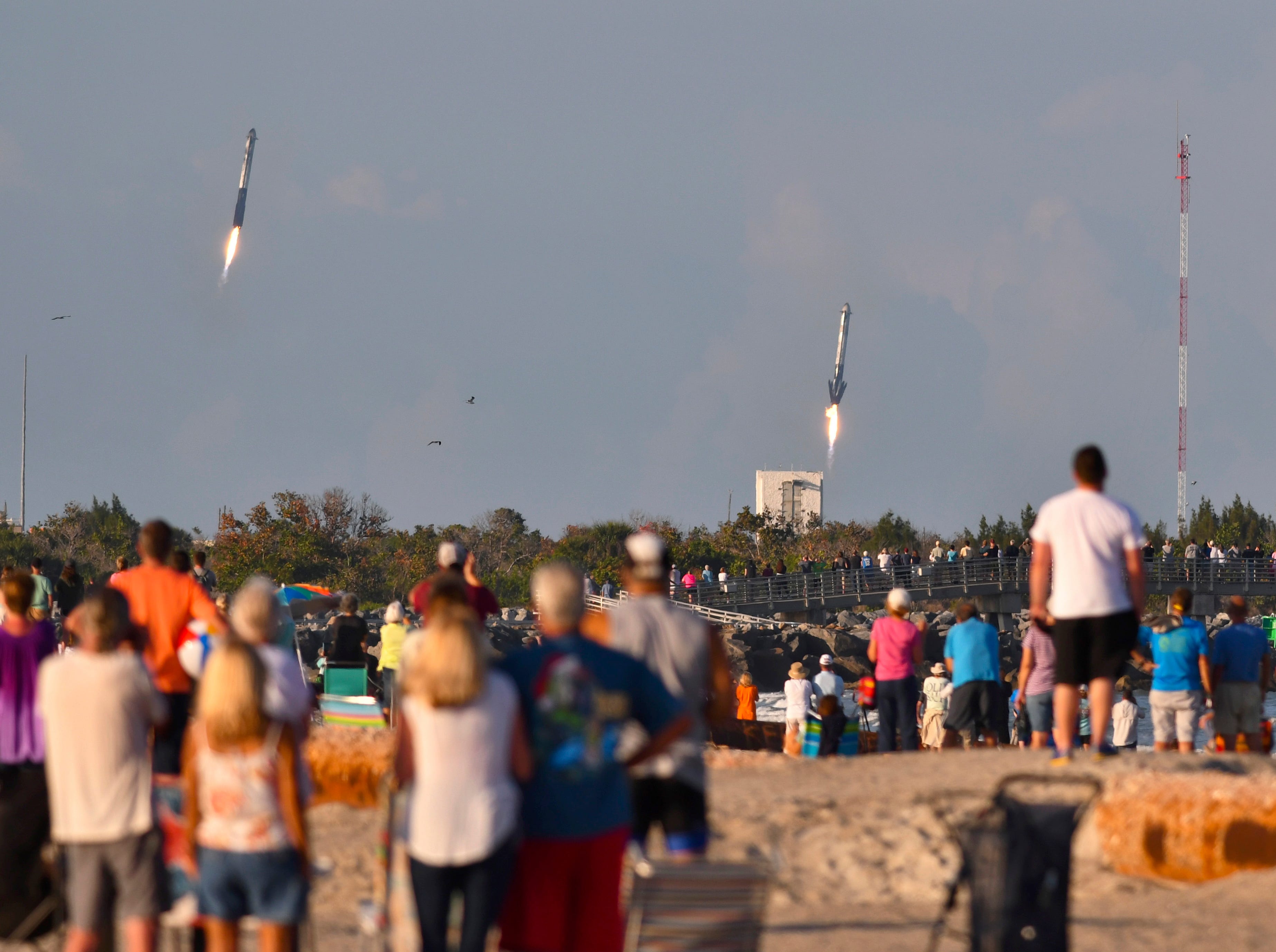 People on the beach in the north end of Cape Canaveral got a great view of the launch and landing of the SpaceX Heavy launched from Launch Pad 39A at Kennedy Space Center Thursday evening at 6:35 p.m. The rocket was carrying the Arabsat 6A communications satellite. The side boosters landed at Cape Canaveral Air Force Station and the core booster landing on the “Of Course I Still Love You” Drone ship.