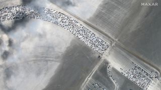 The traffic can already be seen days ahead of this year's Burning Man, as seen in satellite images released by Maxar Technologies. 