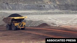 FILE - A dump truck hauls coal at Contura Energy's Eagle Butte Mine near Gillette, Wyo., March 28, 2017. Mine owner Blackjewel says it has filed for Chapter 11 bankruptcy protection. It operates mines in Wyoming, Kentucky, Virginia and West Virginia.