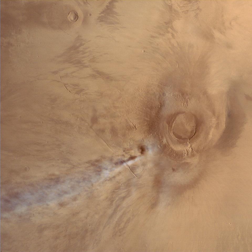  Mars Orbiter Mission image of the Tharsis volcano Arsia Mons, with an orographic cloud streaming away to the southeast. This image was taken by the orbiter on January 4, 2015, while the spacecraft was at an altitude of 10800 km.