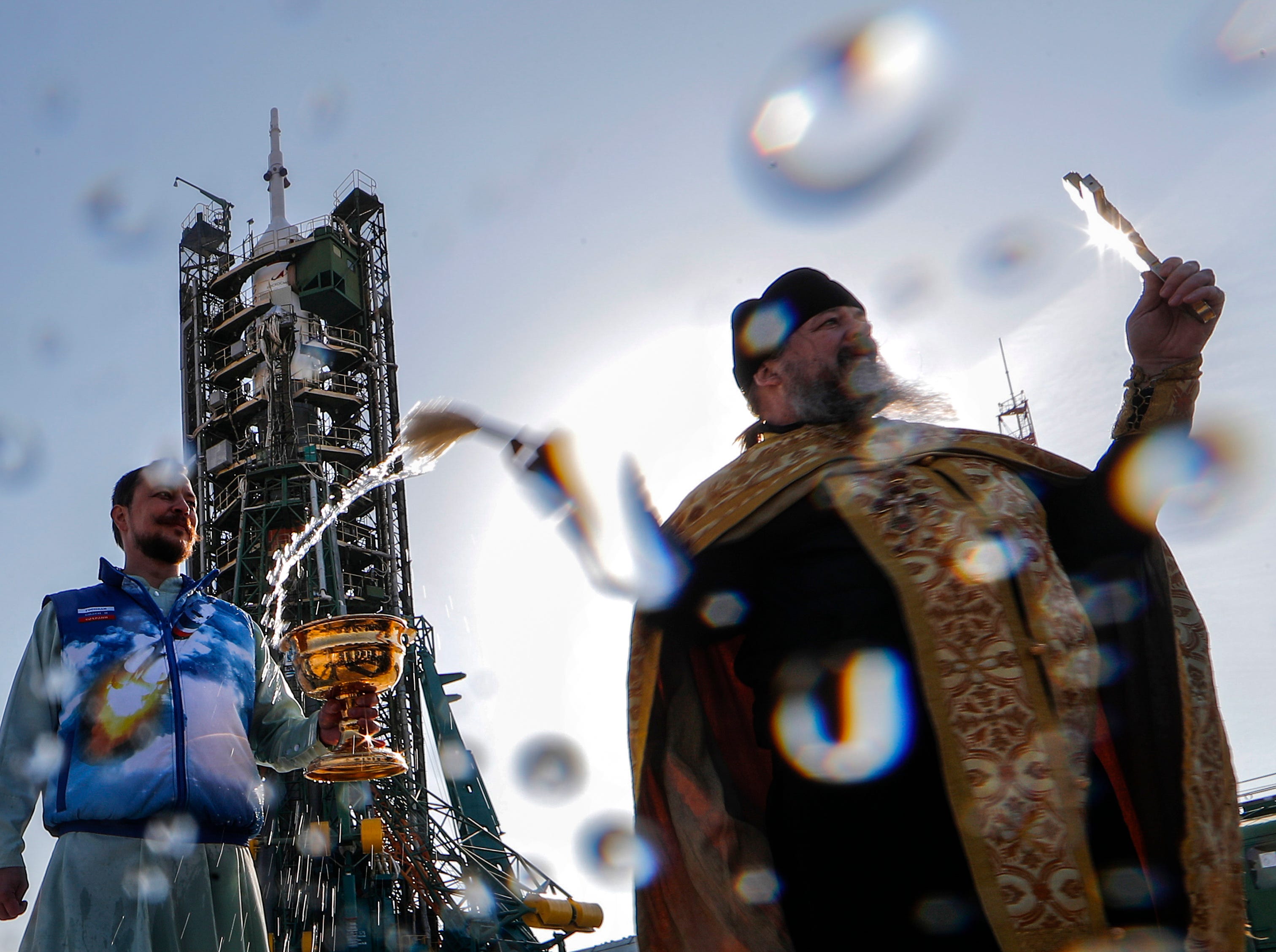 An Orthodox priest blesses the Russian Soyuz MS-12 spacecraft on the launch pad at the Baikonur Cosmodrome, Kazakhstan, 14 March 2019. Russian cosmonaut Alexey Ovchinin, NASA astronauts Christina Koch and Nick Hague will launch March 14, 2019.