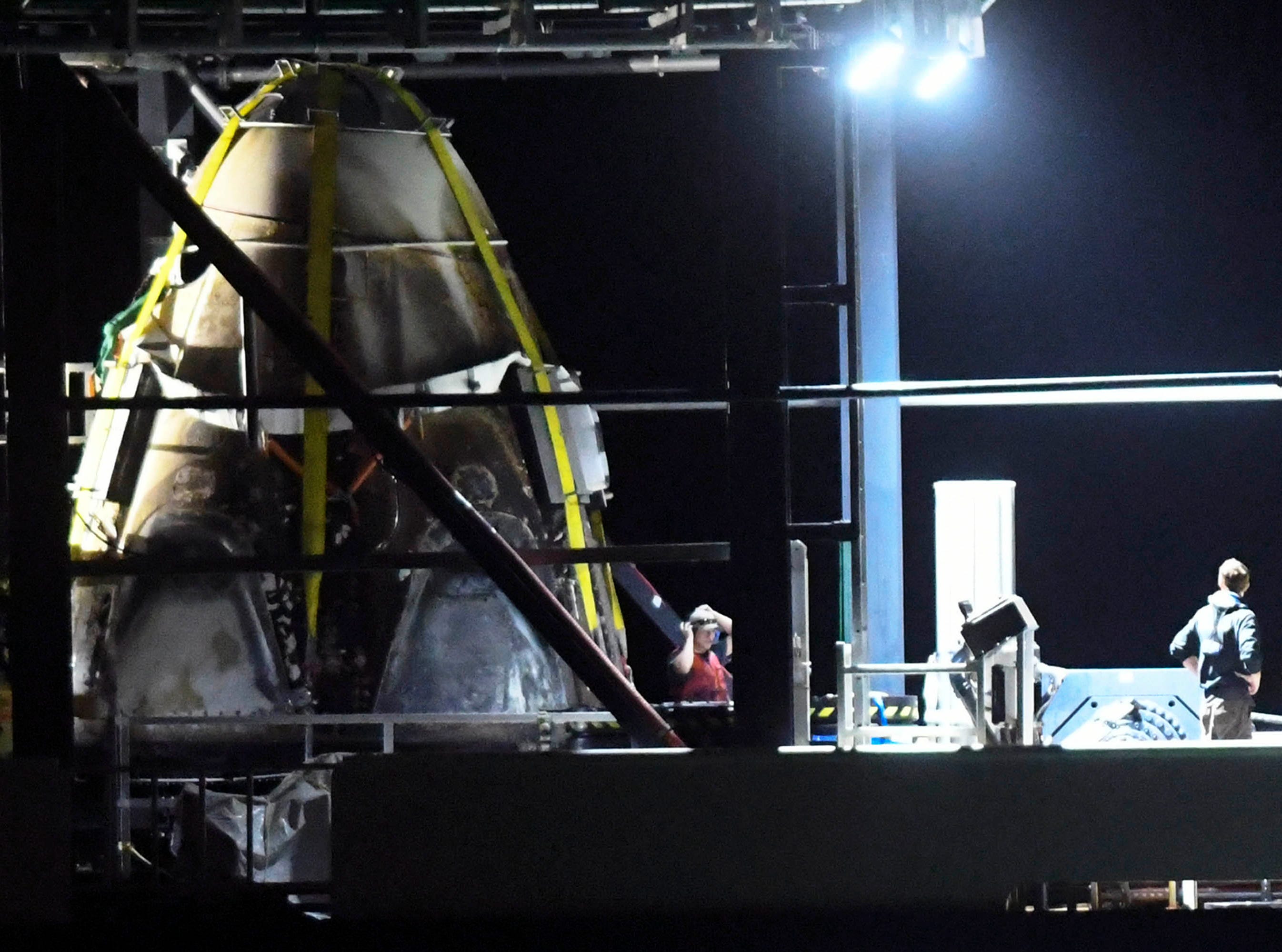 The SpaceX Crew Dragon capsule aboard the support ship Go Searcher, returns to Port Canaveral March 9, 2019. The capsule, launched aboard a Falcon 9 rocket last week, made a trip to the International Space Station before returning to Earth. 