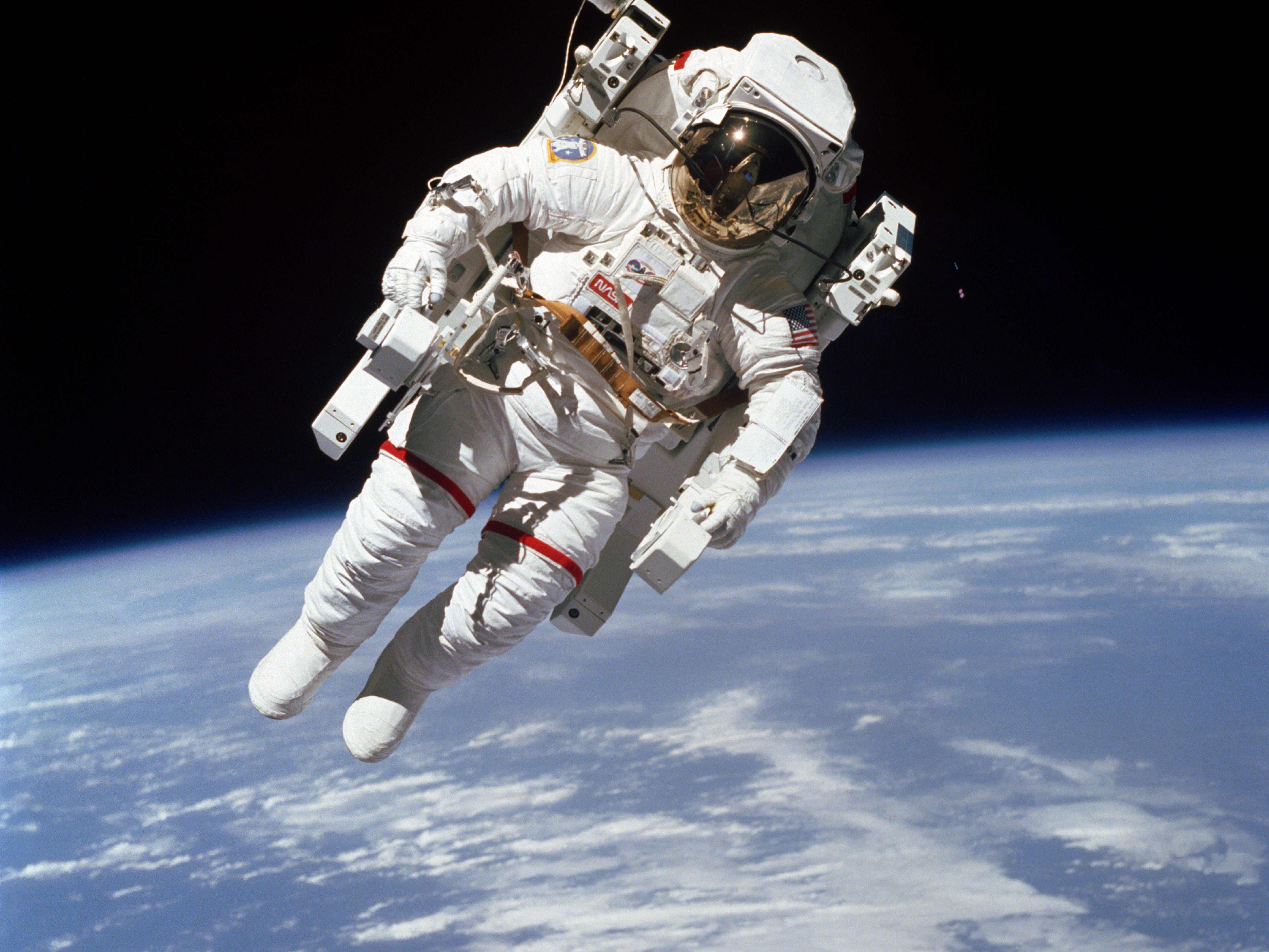 Astronaut Bruce McCandless II, during a spacewalk, Feb. 7, 1984. This spacewalk represented the first use of a nitrogen-propelled, hand-controlled device called the Manned Maneuvering Unit (MMU), which allows for much greater mobility. 