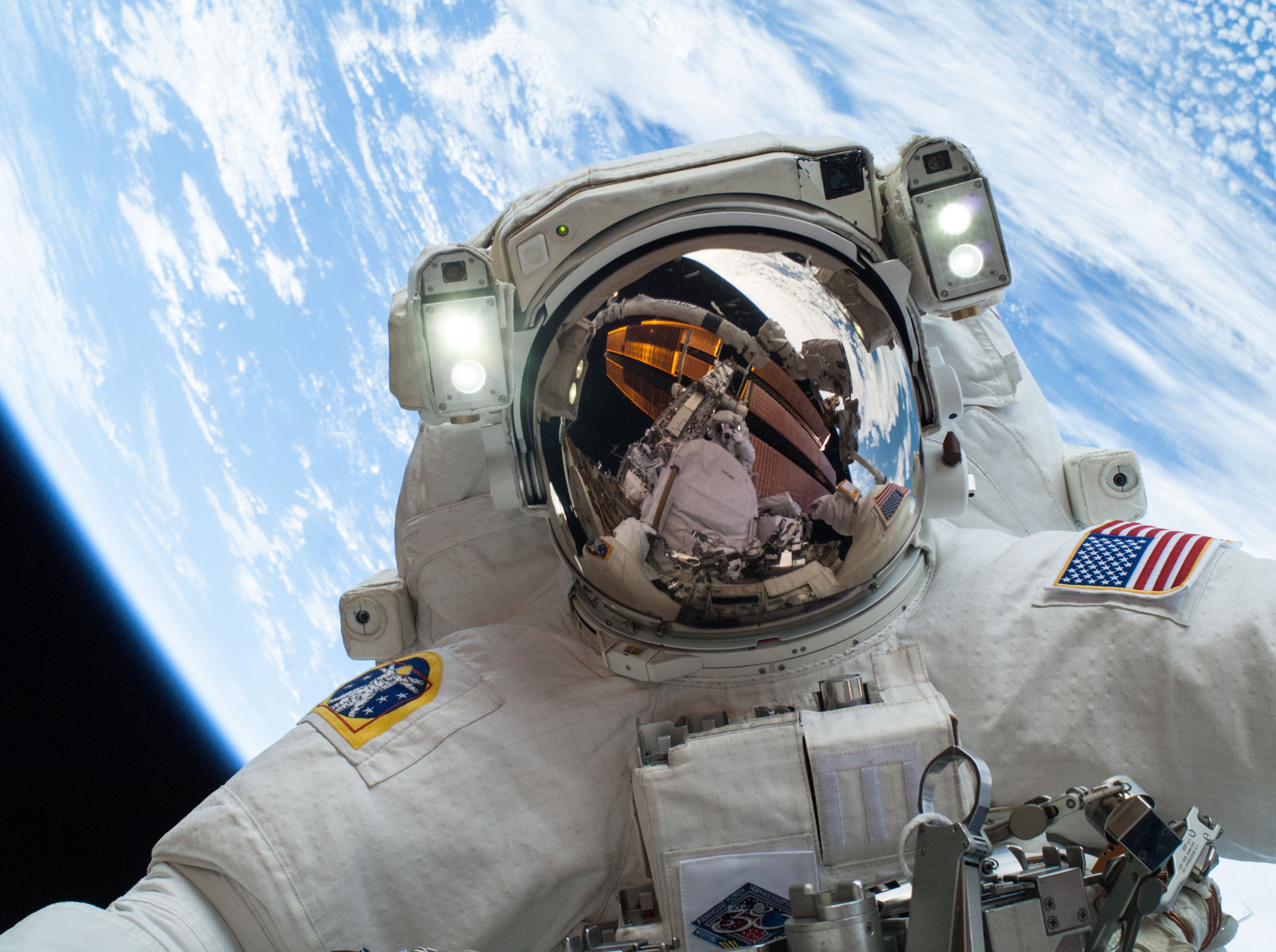 NASA astronaut Mike Hopkins, Expedition 38 Flight Engineer, participates in the second of two spacewalks, spread over a four-day period, which were designed to allow the crew to change out a degraded pump module on the exterior of the Earth-orbiting International Space Station, Dec. 24, 2013. 