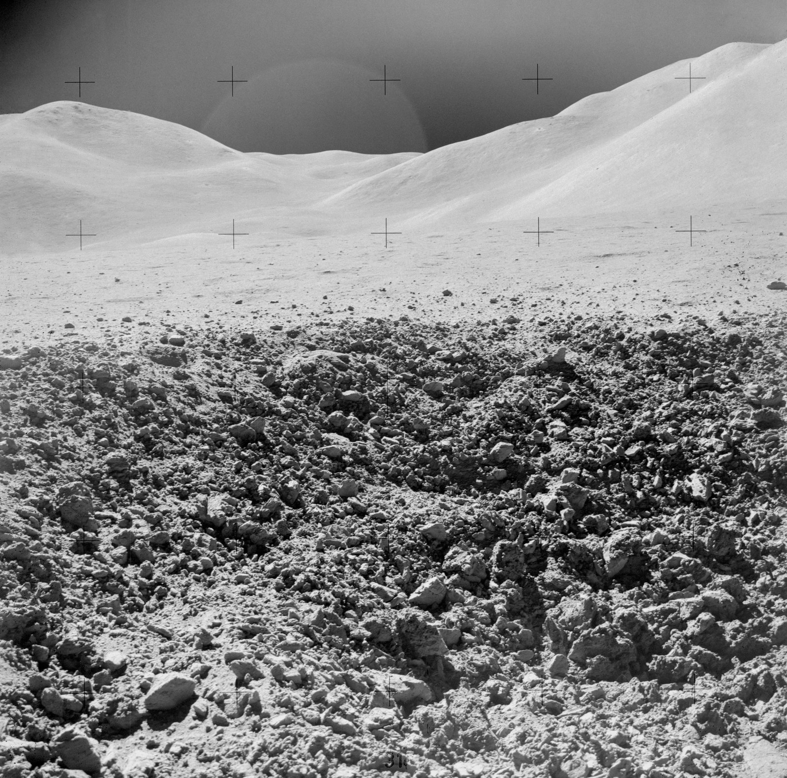 rocks in front of a fresh crater