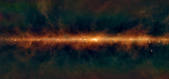 This MWA radio image shows a new view of the Milky Way, with the lowest frequencies in red, middle frequencies in green, and the highest frequencies in blue. Huge golden filaments indicate enormous magnetic fields, supernova remnants are visible as little spherical bubbles, and regions of massive star formation show up in blue. The supermassive black hole at the center of our Galaxy is hidden in the bright white region in the center. Image credit: Natasha Hurley-Walker, ICRAR & Curtin / GLEAM Team.