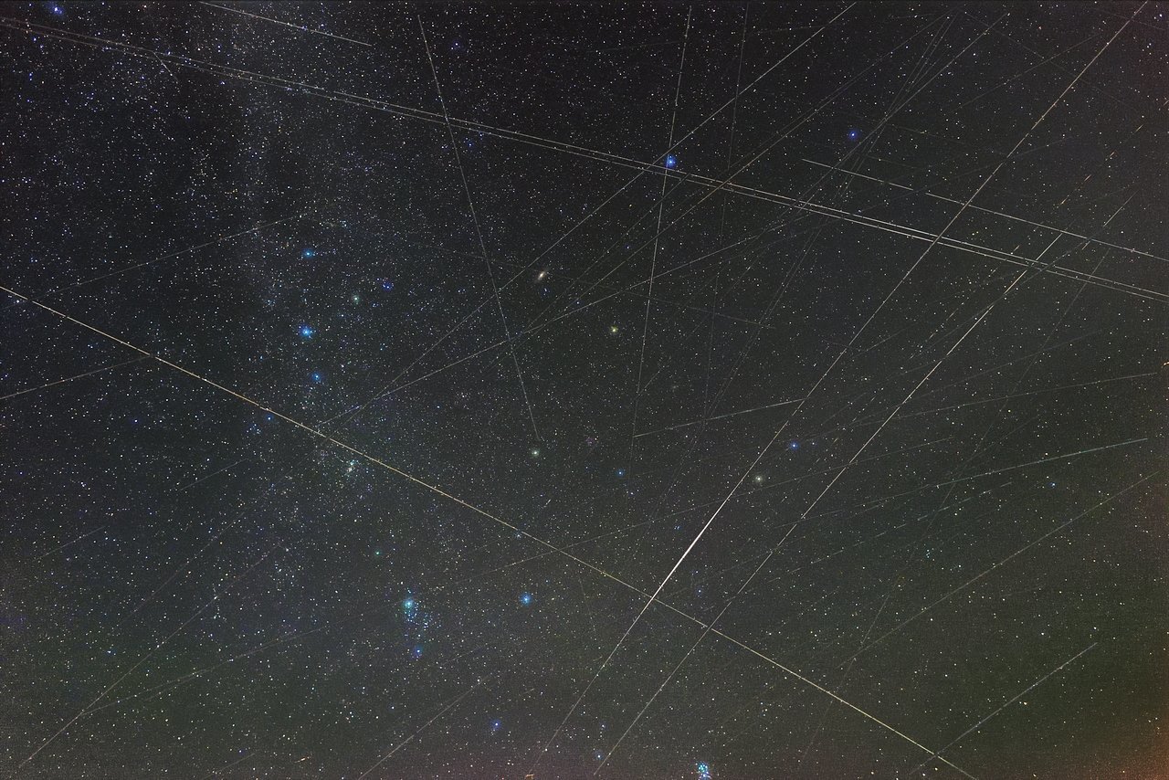 Satellites appear as streaks across this image of a meteor shower in 2018, before the launch of the first Starlink satellites