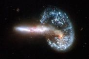 Cosmic shock NASA dancing galaxies Arp 293 gravity space news hubble telescope pictures