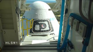 Boeing's first CST-100 Starliner spacecraft stands atop its United Launch Alliance Atlas V rocket during a "wet-dress" launch day rehearsal on Dec. 6, 2019.