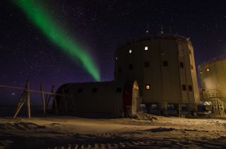 A brilliant aurora appears to rise like a glowing, green smoke plume from Concordia research station in Antarctica in this photo by European Space Agency (ESA) photographer Alessandro Mancini. 