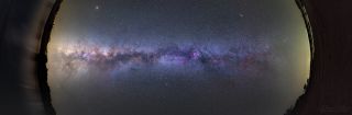 A large panoramic image composed of nine frames shows the long stretch of the Milky Way galaxy, as seen from the Northern Hemisphere in Portugal's Dark Sky Alqueva Reserve. 