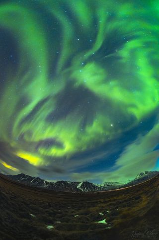 Astrophotographer Miguel Claro captured this spectacular vertical panorama or the aurora borealis from the Arctic Circle. Can you see the shape of a bird flying with a running rabbit?