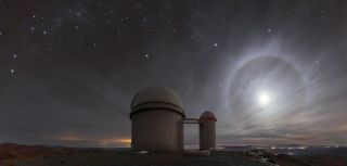 A lunar "halo" lights up the night sky above the 3.6-meter telescope at the La Silla Observatory in Chile. This phenomenon happens when the moon is at an altitude of about 22 degrees above the horizon, where light refracts through icy cirrus clouds. "Light rays that do this tend to 'bunch up' at the angle that represents the least amount of deviation from their original path. For the particular shape of ice crystal lurking within the cirrus clouds, this minimum deviation angle happens to be around 22 degrees," ESO officials said in a description. 