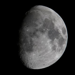 A composite image of five shots of the International Space Station as it passed in front of the moon on March 16, 2019. 