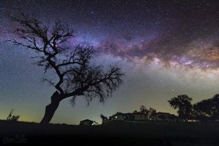 The Milky Way rises over the Nature Park of Noudar in Portugal's Dark Sky Alqueva.