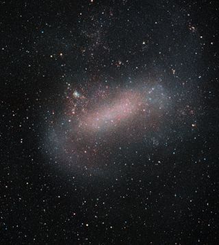 The Large Magellanic Cloud (LMC), one of the Milky Way's closest galactic neighbors, gets a new close-up in this image from the European Southern Observatory's VISTA telescope at the Paranal Observatory in Chile. VISTA, which stands for the Visible and Infrared Survey Telescope for Astronomy, has been studying this dwarf galaxy and its smaller galactic sibling, the Small Magellanic Cloud (SMC), for the past decade to image the two galaxies in unprecedented detail. The LMC is located about 163,000 light-years away from Earth, while the SMC is slightly farther away at a distance of 200,000 light-years. Both are satellite galaxies of the Milky Way.