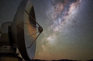 A meteor blazes across the Milky Way galaxy in this colorful view from the La Silla Observatory in Chile's Atacama Desert, captured by European Southern Observatory photo ambassador Babak Tafreshi. The starry night sky and orange airglow near the horizon are reflected in the dish of the Swedish-ESO Submillimetre Telescope (SEST). 