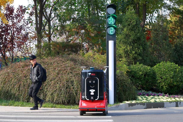 A driverless delivery robot crossing the road in Tianjin, China, in November.