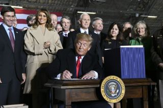 President Donald Trump signs S.1790, the National Defense Authorization Act for Fiscal Year 2020, on Dec. 20, 2019, at Joint Base Andrews. The act directed the establishment of the U.S. Space Force as the sixth branch of the armed forces.