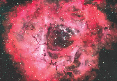  Pictured is the Rosette Nebula in the constellation Monoceros. This is a large emission nebula that is actually easier to see with binoculars from a very dark location than with a telescope because it is so large. 