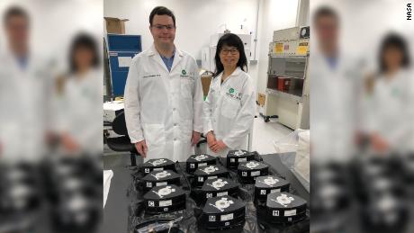 Chunhui Xu and Antonio Rampoldi, a postdoctoral fellow at Emory University, pack their Multi-use Variable-gravity Platform experiment modules containing their samples before launch.