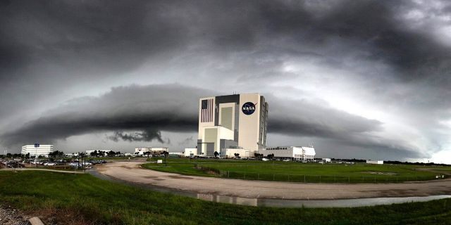 File photo - In this panoramic view, thunderstorms flank the Vehicle Assembly Building at Kennedy Space Center, Fla., Tuesday, August 6, 2019.