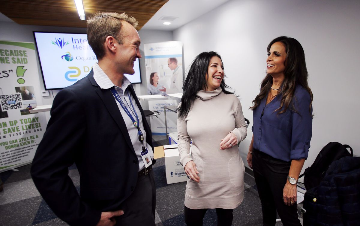 Jake Krong, left, research operations manager for Intermountain Healthcare’s transplant services, and Dr. Diane Alonso, director of Intermountain’s abdominal transplant program, talk with Laura Adams who is liver recipient, after a press conference where officials talked about a new pump that is being used to transport organs for patients at Donor Connect in Murray on Monday, Monday 2, 2020. Intermountain Healthcare and Donor Connect worked together to acquire a liver pump for use with transplant patients.