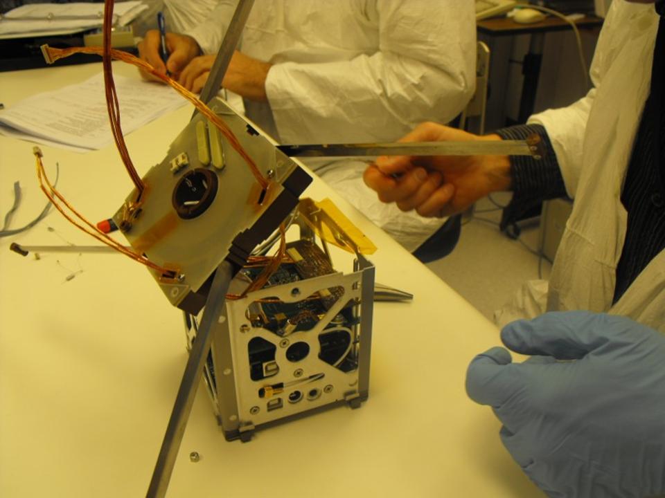 Student technicians build satellite 