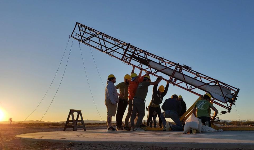 Students stand up rocket.