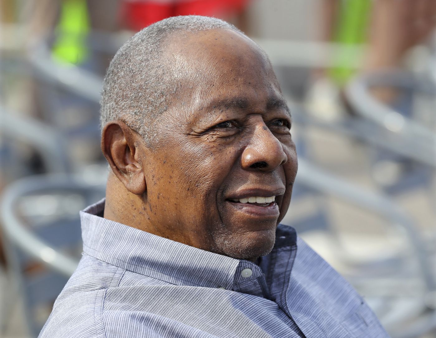 Baseball Hall of Famer Hank Aaron smiles as he is honored with a street named after him outside CoolToday Park, the spring training baseball facility for the Atlanta Braves.