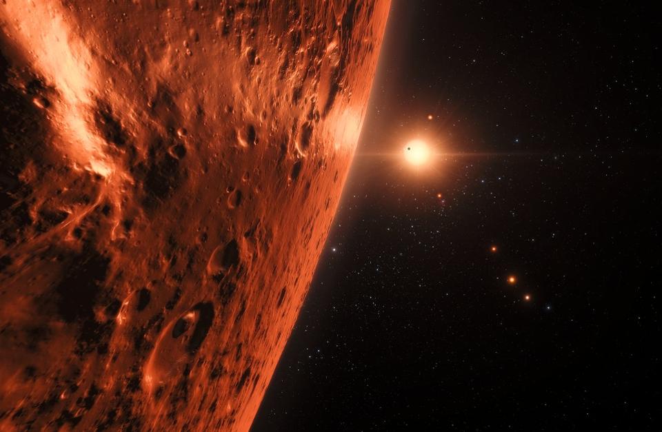 This artist’s impression shows the view from the surface of one of the planets in the TRAPPIST-1 system.