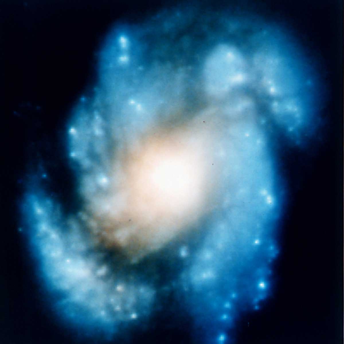 A blurry image of a spiral galaxy.