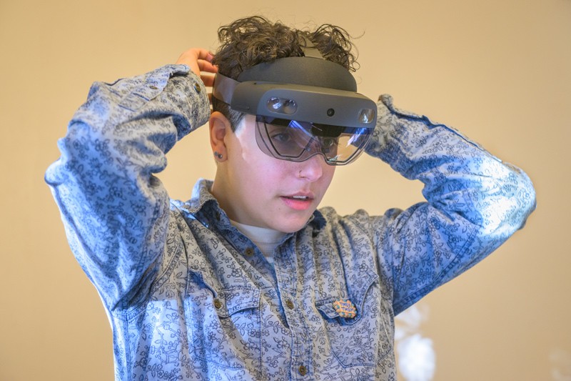 Margalit Schindler, a graduate of the Winterthur/UD Program in Art Conservation and now principal conservator with Pearl Preservation, adjusts the HoloLens 2 headset before beginning a walk-through of Rockwood Museum.