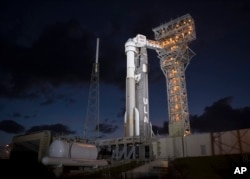 A United Launch Alliance Atlas V rocket with Boeing's CST-100 Starliner spacecraft onboard is seen on the launch pad at Space Launch Complex 41 ahead of the Orbital Flight Test mission, Wednesday, Dec. 18, 2019 at Cape Canaveral Air Force Station in Florida. (Image Credit: Joel Kowsky/NASA via AP)