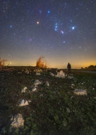 Orion and its dimming star Betelgeuse shine over a stargazer in this sentimental night-sky photo – Space.com